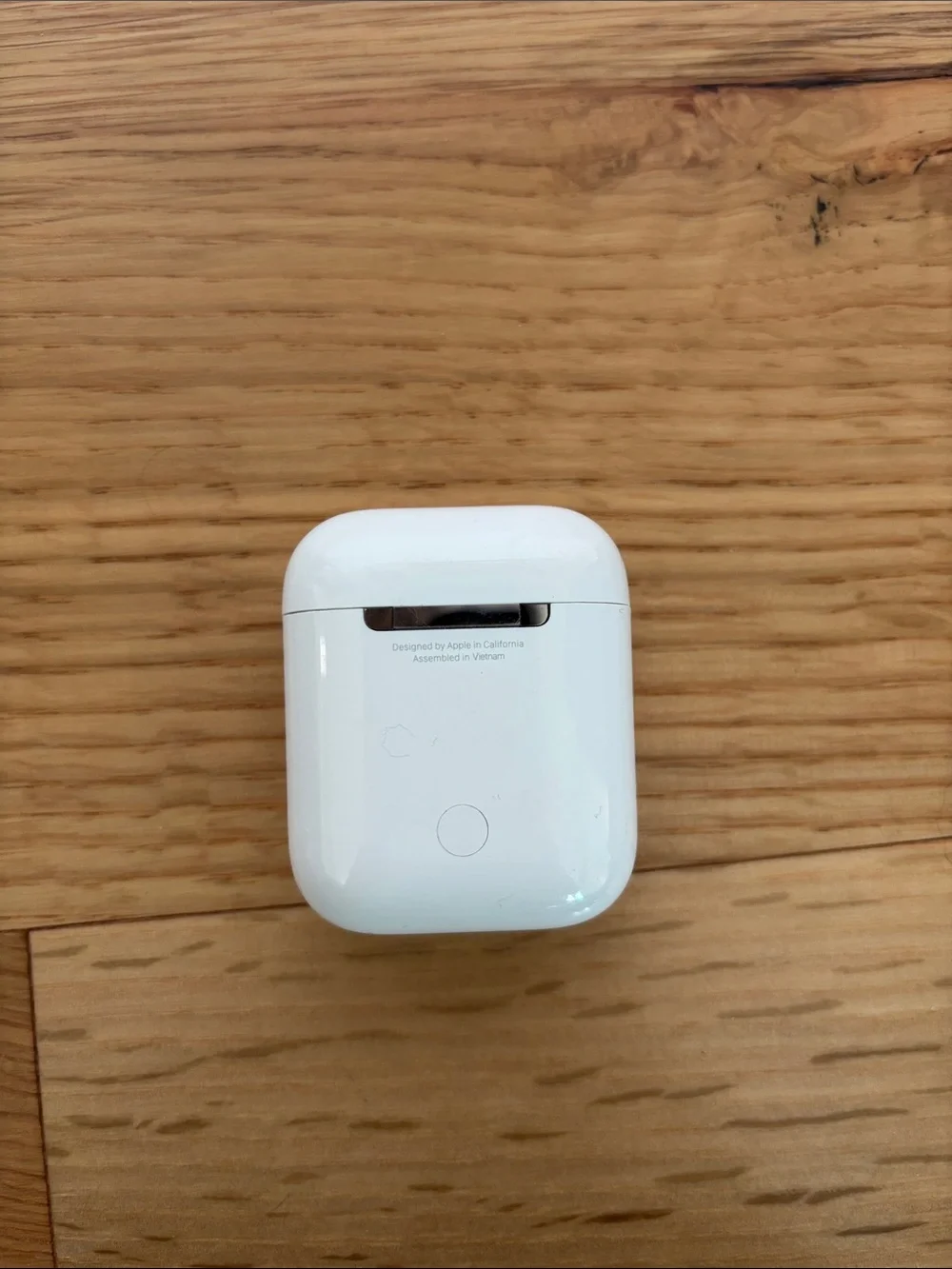 Apple AirPods (2nd gen) with charging case, charging cable, and ThredUp case